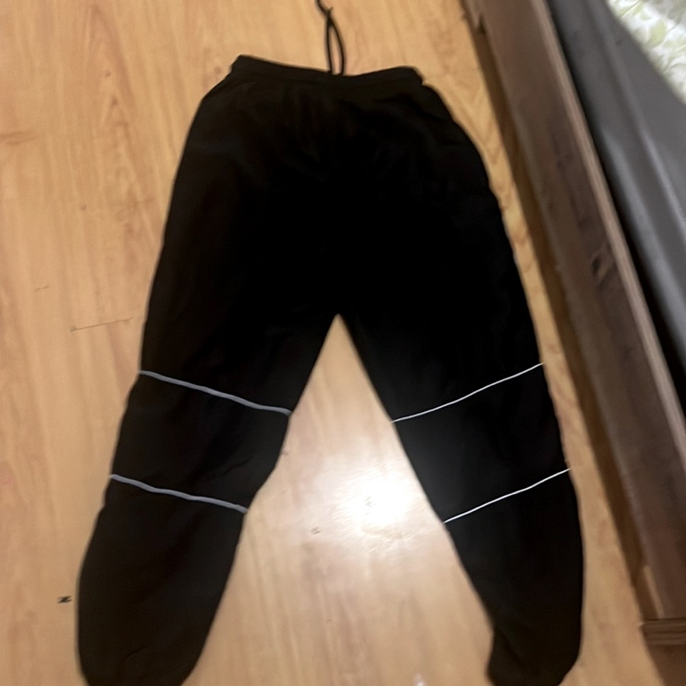 It’s from forever 21, it’s a nice black color, it has silver stripes size small